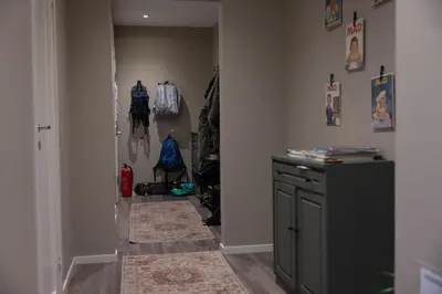 a hallway leading to a room with a closet at Big apartment in central Aalesund in Ålesund