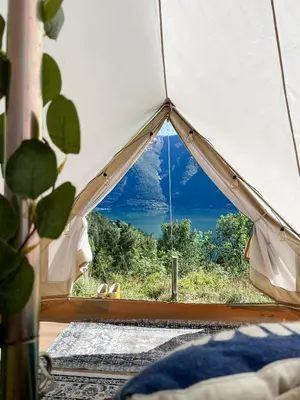 a tent with a view of a mountain at Glamping Kalhagen in Vangsbygd