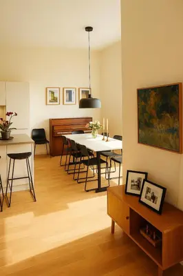 a living room with a table and a dining room at Panoramic View & Comfort in Ålesund