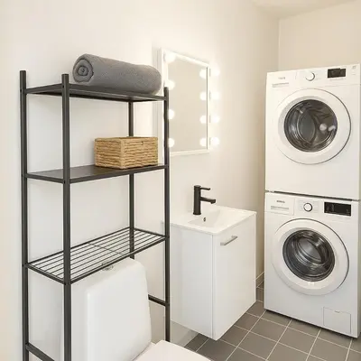 a laundry room with a washer and dryer at Panoramic View & Comfort in Ålesund