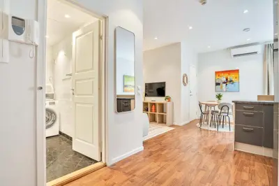 a kitchen and living room with a large mirror at Heimby - Roomy Studio w Free parking and SeaView in Bergen