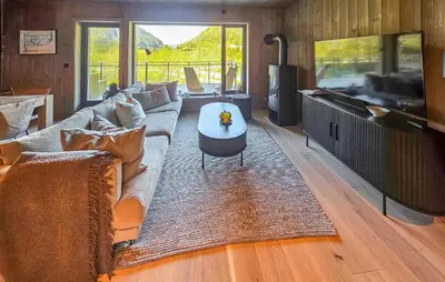 a living room with a couch and a table at Stunning Apartment In Hemsedal in Hemsedal
