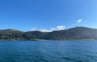a large body of water with mountains in the background at 3 Bedroom Awesome Home In Gursken in Larsnes