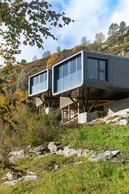 a house on top of a hill at Torvika Seaview Pods in Bølandet