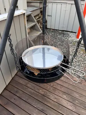 a tub on a grill on a deck at Cozy chair in Jølster in Skei