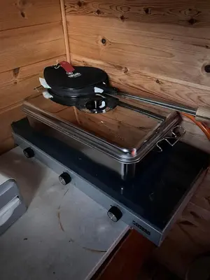 a pan sitting on top of a stove at Cozy chair in Jølster in Skei