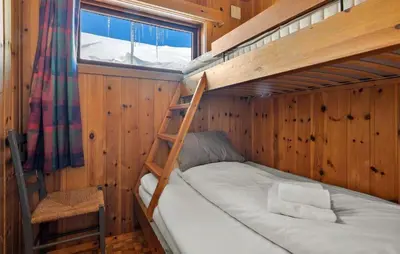 a bedroom with two bunk beds and a window at Gorgeous Home In Vøringsfoss With Sauna in Maurset