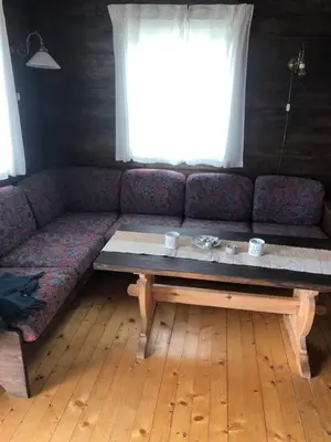 a living room with a couch and a coffee table at Syndinstøga in Ryfoss