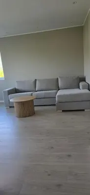 a living room with a couch and a coffee table at Modern house in Bergen