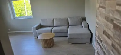a living room with a couch and a coffee table at Modern house in Bergen