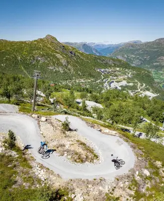 a group of bikes parked on a mountain road at New and exclusive chalet apartment with mountain panorama view in Tuv