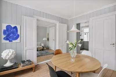 a dining room with a table and chairs at Central apartment with 2 bedrooms in Bergen