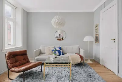 a living room with a couch and a coffee table at Central apartment with 2 bedrooms in Bergen