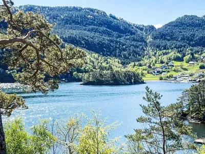a view of a river with mountains in the background at Holiday Home Tussebu by Interhome in Gripne