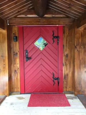 a red door with a window on it at Holiday cabin, Kristianplass at Bjorli, Lesja in Bjorli