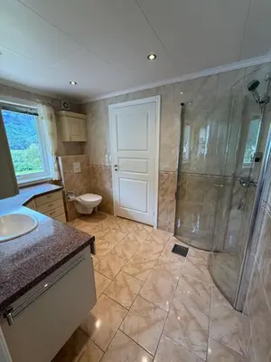 a bathroom with a shower and a toilet at Stryn Central View in Stryn
