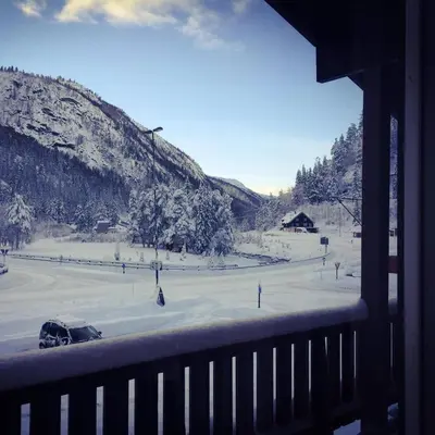 a view from a balcony of a snow covered field at Haukeli Hotel in Haukeligrend