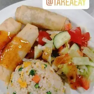 a white plate of food with rice and vegetables at Haukeli Hotel in Haukeligrend