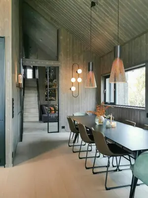 a dining room with a table and chairs at Family Cabin With Annexe In Haglebu in Eggedal