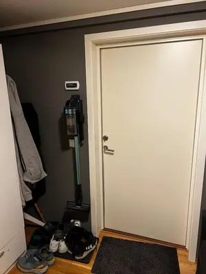 a door in a room with shoes on the floor at Staupslia Apartment in Levanger