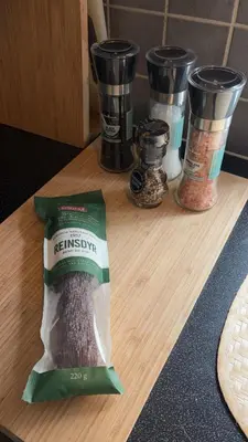 a bag of rice on a cutting board with some cups at Hyggehuset in Bergen