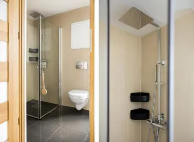 a bathroom with a toilet and a glass shower at Sentral leilighet, Bergen in Bergen