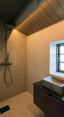 a bathroom with a shower and a sink and a window at Timber Cabin By The Ski Slopes In Oppdal in Oppdal