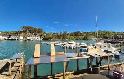 a dock with boats docked in a marina at Nice Apartment In Auklandshamn in Vestvik