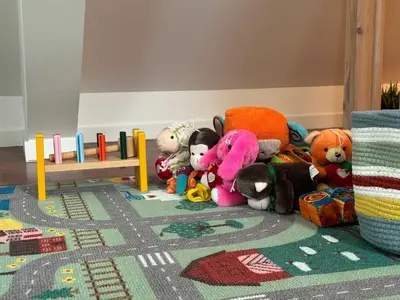 a group of stuffed animals sitting on the floor in a room at Heimby Homes - Four Bedroom Family Penthouse in Bergen