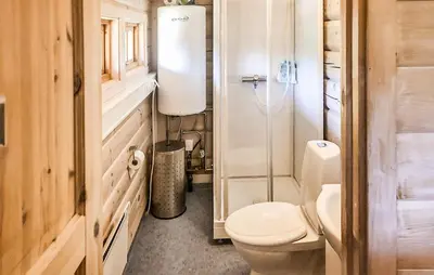a small bathroom with a toilet and a sink at 4 Bedroom Stunning Home In Tynset in Tynset