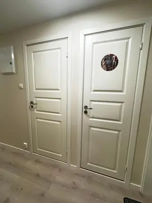 a white door with a sticker on it in a room at Alesund center room with double bed in Ålesund