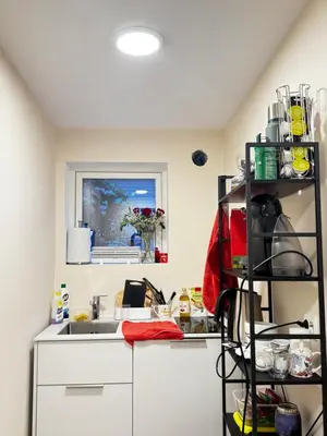 a kitchen with a sink and a shelf at Alesund center room with double bed in Ålesund