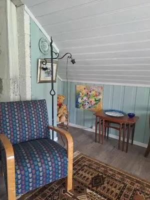 a living room with a couch and a table at xxx in Ryfoss