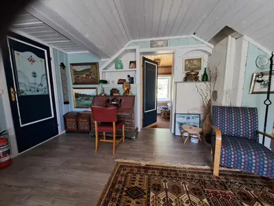 a living room with a couch and a table at xxx in Ryfoss