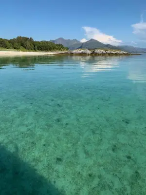 a large body of water with a beach at Posthuset Expedition Lodge in Lii