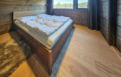 a large bed in a room with a window at 4 Bedroom Stunning Home In Eggedal in Eggedal