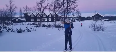 a person is standing on skis in the snow at Lauvåsen - Langleiken in Sør-Fron