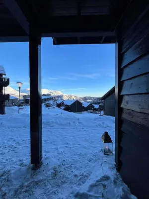 a view of a snow covered yard with a building at Ski in-ski out leilighet Hemsedal in Fausko