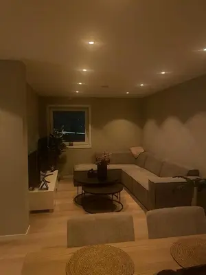 a living room with a couch and a table at Daniels House in Kristiansund