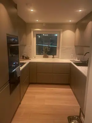 a kitchen with a window and a sink and a stove at Daniels House in Kristiansund