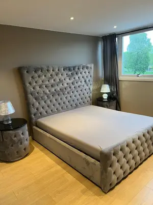a large bed in a bedroom with a window at Trondheim in Trondheim