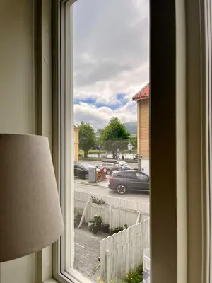 a window with a view of a parking lot at Central apartment in Bergen City Center in Bergen