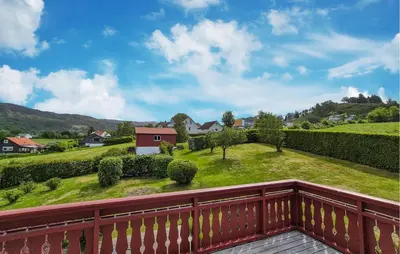 a view from the balcony of a house with a yard at Awesome Home In Fitjar With Wifi in Fitjar
