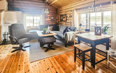 a living room with a couch and a table at 2 Bedroom Lovely Home In Nesbyen in Nesbyen