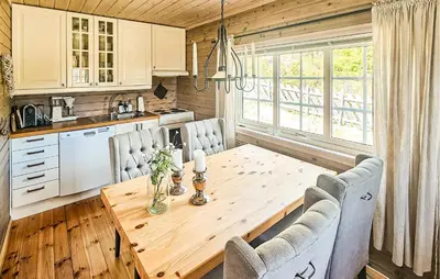 a kitchen and dining room with a wooden table and chairs at 2 Bedroom Lovely Home In Nesbyen in Nesbyen