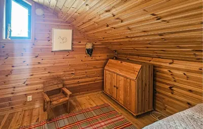 a room with a wooden room with a wooden wall at Stunning Home In Edland With Sauna in Nesland
