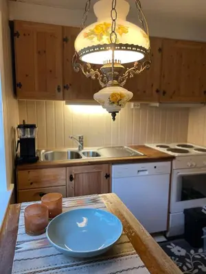 a kitchen with a table with a blue bowl on it at Arnestova - villagehouse in Loen in Loen