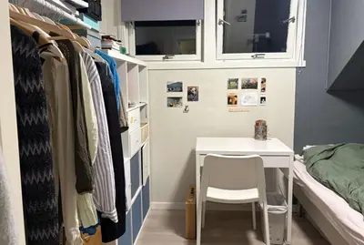 a small room with a desk and a bed at Small apartment with 4 bedrooms close to city in Trondheim