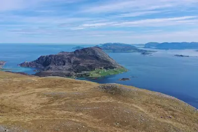 an island in the middle of a body of water at Stavetunet in Stadlandet