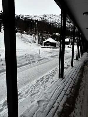 a view of a snow covered street from a building at Apartment Øvre Tråstølen - Voss in Vossevangen